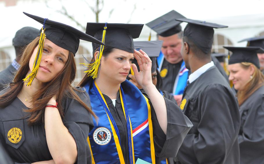 Graduates line up before the start of the University of Maryland University College Europe commencement on Saturday, May 9, 2015, at the Gartenschau in Kaiserslautern, Germany.