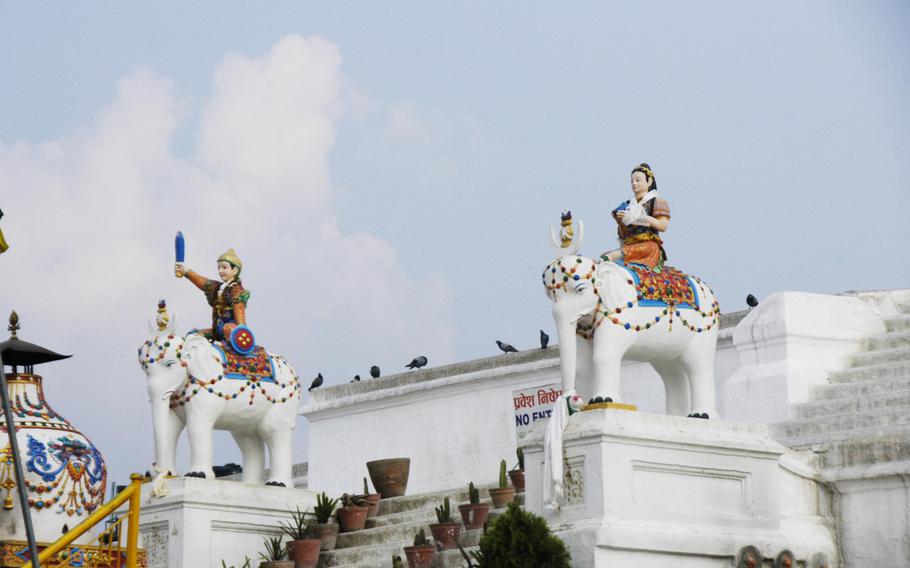 Buddhist art decorates the Boudhanath Stupa in Kathmandu, Nepal. The stupa is the holiest Tibetan Buddhist temple outside of Tibet.