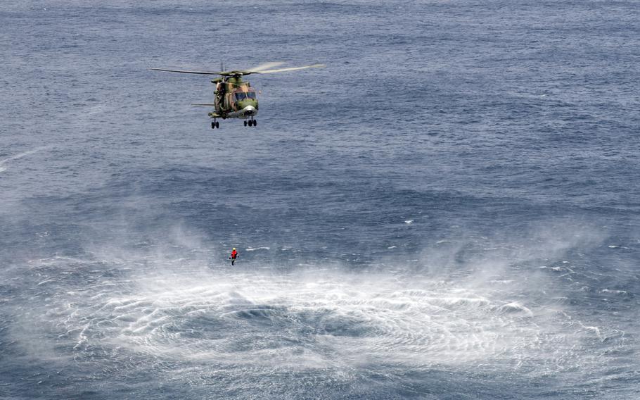 A Portuguese air force EH-101 Merlin helicopter hovers near a simulated accident site during a joint exercise on Terceira, Azores, Portugal, on  May 6, 2015.