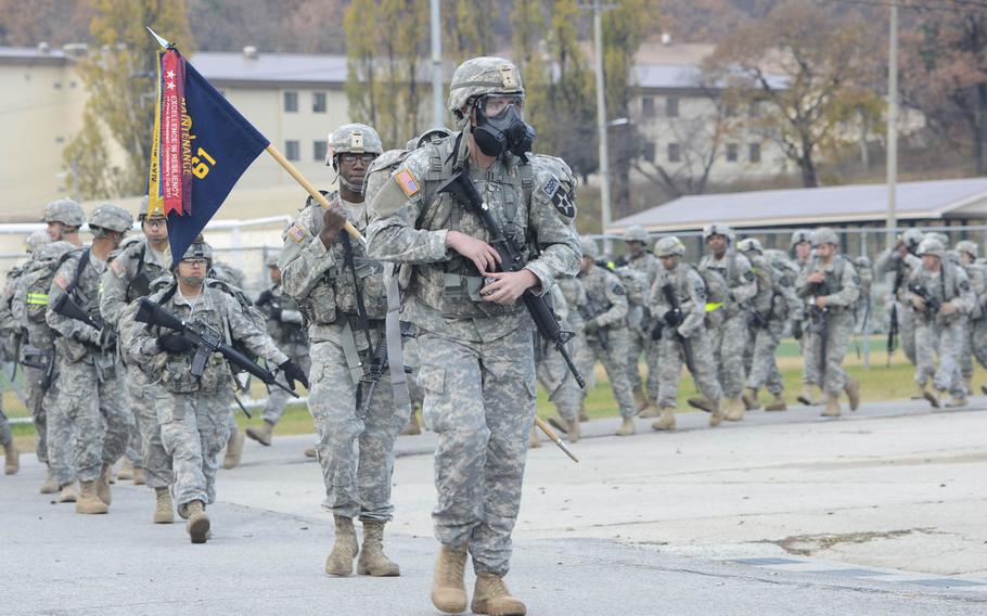 Soldiers from the 1st Armored Brigade Combat Team, 2nd Infantry Division start the Manchu Mile on Nov. 6, 2014, in South Korea. More than 800 soldiers participated in the 25-mile road march.