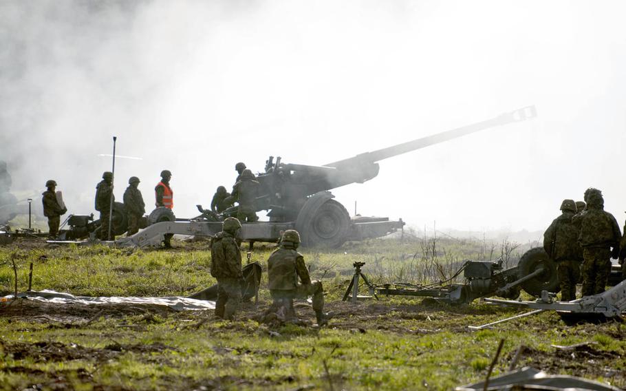 Soldiers with the Estonian Defense Forces conduct an artillery live fire on May 8, 2015, at the Central Training Area. During the training, the fire teams were tested for accuracy as well as speed.