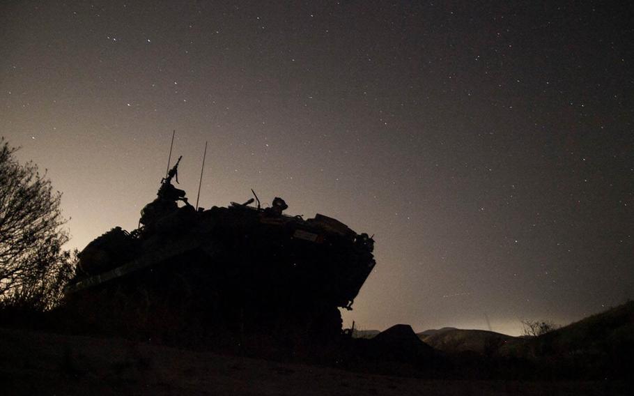 A Light Armored Vehicle with 1st Light Armored Reconnaissance Detachment, Battalion Landing Team 3rd Battalion, 1st Marine Regiment, 15th Marine Expeditionary Unit, provides security for an amphibious raid during Certification Exercise (CERTEX) at Camp Pendleton, Calif., April 19, 2015.