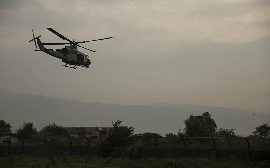 A UH-1Y Huey helicopter takes off for a search and rescue mission from the Tribhuvan International Airport in Kathmandu, Nepal, May 13, 2015. A UH-1Y Huey assigned to Marine Light Attack Helicopter Squadron 469, carrying six Marines and two Nepalese soldiers, went missing while conducting humanitarian assistance after a 7.3 magnitude earthquake May 12, 2015.