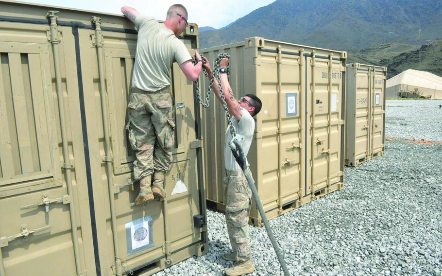Pfc. Ty Cummings, left, and Sgt. Lucas Strozak prepare a shipping container to be picked up by helicopter at Forward Operating Base Joyce in eastern Afghanistan in June 2013. When NATO officially wrapped up its combat operations and withdrew the bulk of international forces at the end of 2014, the alliance's transit agreement with Russia, comprising part of the so-called Northern Route, ended as well.