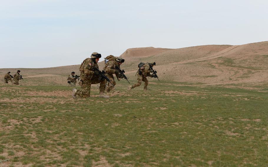 Georgian troops assigned to the Quick Reaction Force at Train, Advise and Assist Command-North secure a valley in northern Afghanistan during an air-assault drill in Balkh province, March 31, 2015.