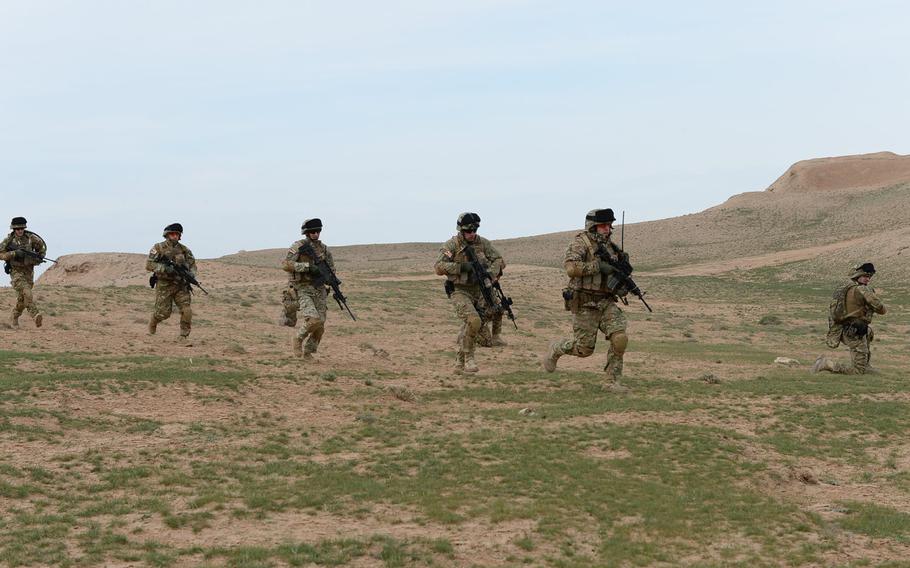 Members of the Quick Reaction Force at TAAC-North move toward their objective during a March 31, 2015, combat drill in Balkh province in northern Afghanistan.