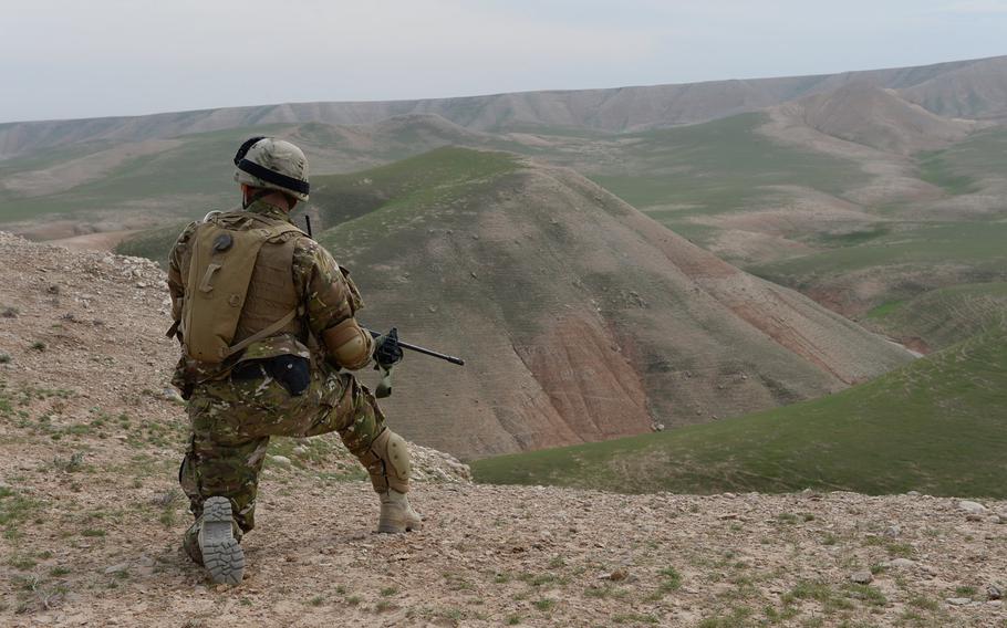 A Georgian soldier stands guard during a combat assault drill by Quick Reaction Forces assigned to Train, Advise and Assist Command-North on March 31, 2015, in Afghanistan's Balkh province.