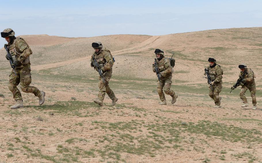 NATO soldiers with the Quick Reaction Force at Train, Advise and Assist Command-North move toward extraction during an air-assault drill in Balkh province, Afghanistan, on March 31, 2015. The team is responsible for providing support to Afghan security forces fighting in the region.