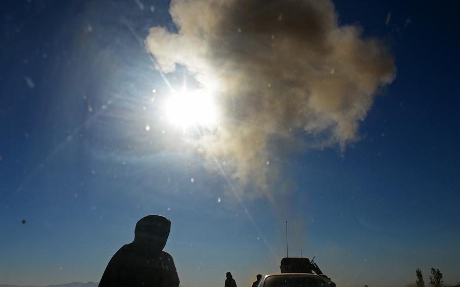 An improvised explosive device explodes on the highway between Camp Shorabak and the regional capial Lashkar Gah in Helmand province, May 15, 2015. Officials at Shorabak have abandoned counterinsurgency patrols to villages surrounding the base, and the Taliban continue to attack.