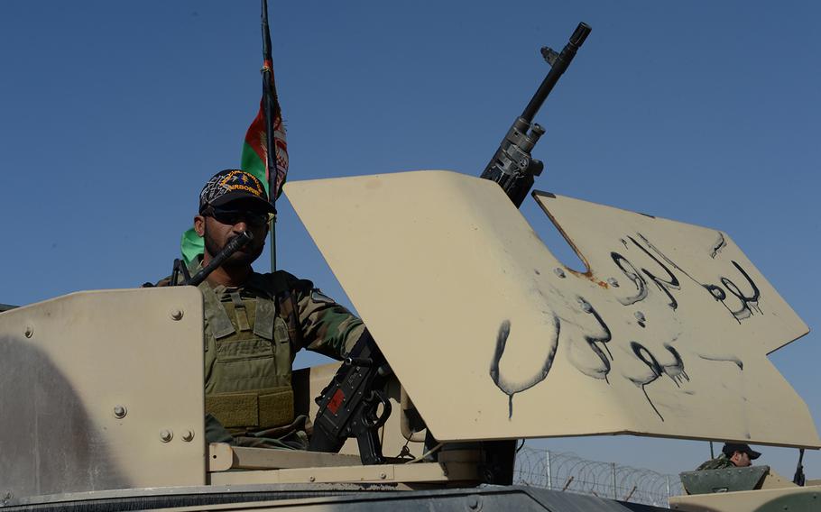 An Afghan special forces soldier with the army's 215 Corps waits in a Humvee's gun turret ahead of a patrol May 12, 2015 in Helmand province. This is the first fighting season for the soldiers without coalition forces in the province.