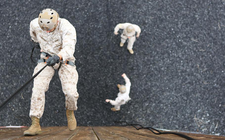 Staff Sgt. Brandon Stanbridge, a reconnaissance Marine with 1st Reconnaissance Battalion, ropes down a rappel tower in preparation for the 7th Annual Recon Challenge aboard Marine Corps Base Camp Pendleton, California, May 15, 2015.