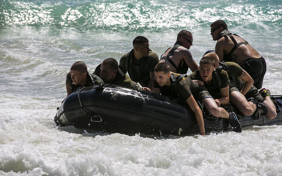 U.S. Marines with the 15th Marine Expeditionary Unit???s Maritime Raid Force ride a combat rubber raiding craft ashore aboard Bellows Air Force Station, Hawaii, May 15, 2015. The 15th MEU???s Force Reconnaissance Detachment helped familiarize the security element Marines with surf passage, broaching and casting procedures.