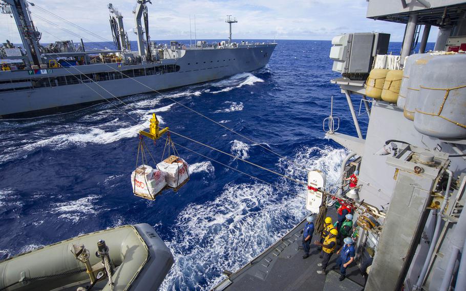 The USS Antietam receives supplies from the Military Sealift Command fleet replenishment oiler USNS Rappahannock during a replenishment-at-sea in waters near Guam on June 2, 2015.