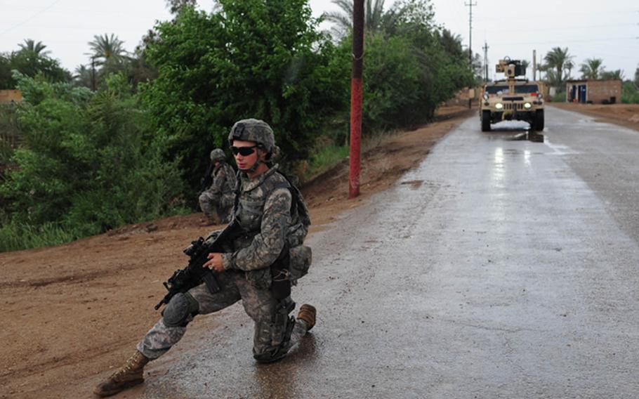 U.S. Army Spc. Tristan Lininger of Tacoma, Wash., provides security in search of caches in Qarghuli, Iraq, on April 12, 2009, in this combat camera photo.