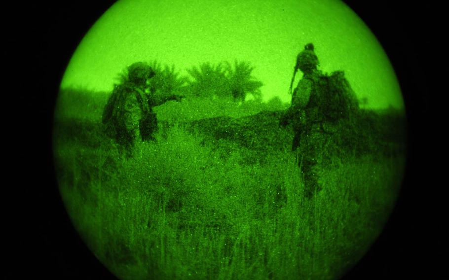 In this combat camera image, U.S. soldiers assigned to Task Force 1st Battalion, 6th Infantry Regiment, 2nd Brigade Combat Team, 1st Armored Division, prepare to take their first objective in Owesat, Iraq, on April 12, 2009. Combat camera troops receive training that allows them to put down the camera and pick up their weapon if necessary.


