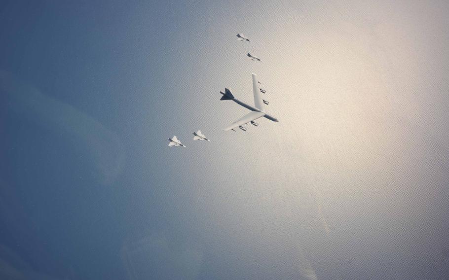 A U.S. Air Force B-52H Stratofortress leads a flight of four Swedish JAS-39 Gripens on June 11, 2015, during a Baltic Operations 2015 mission over the Baltic Sea. The aircraft took part in multiple missions throughout the exercise, including Mk-62 Quickstrike mine drops and naval support functions.