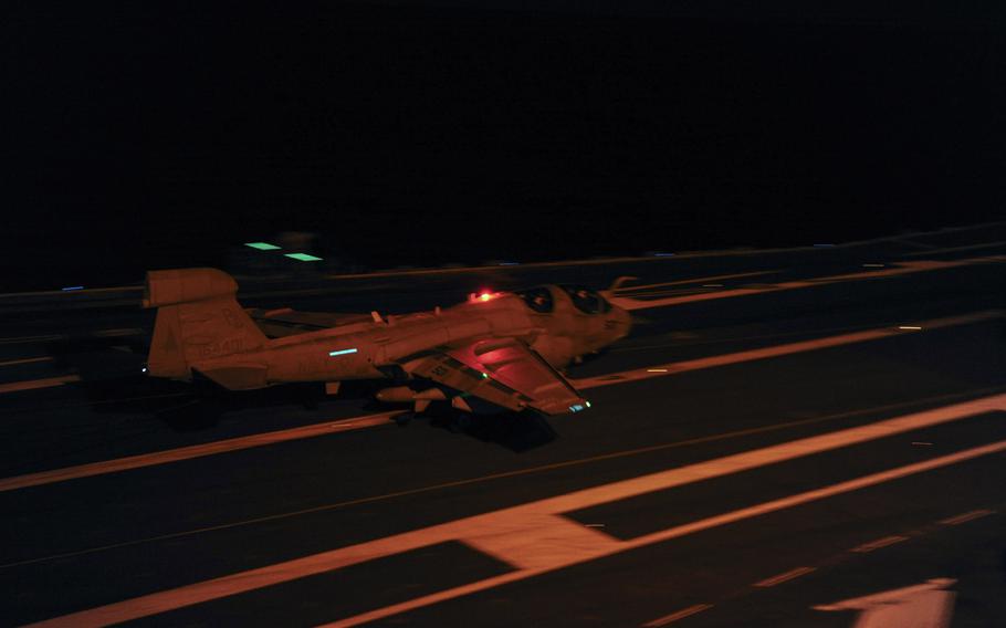 An E/A-6B Prowler assigned to the Garduas of Electronic Attack Squadron 87 lands on the flight deck aboard the Nimitz-class aircraft carrier USS George H.W. Bush February 3, 2015.