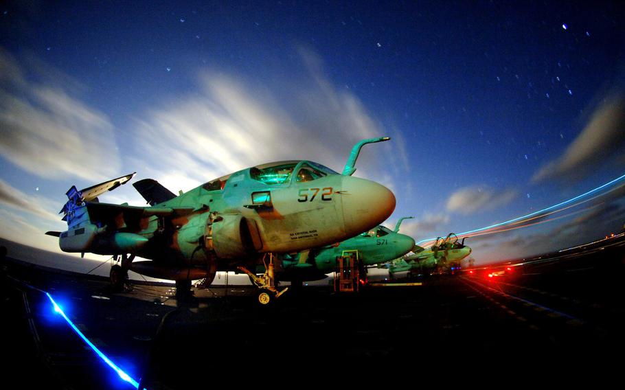 EA-6B Prowlers assigned to the ''Vikings'' of Tactical Electronic Warfare Squadron 129 sit chained to the flight deck aboard the Nimitz-class aircraft carrier USS John C. Stennis on March 16, 2006.