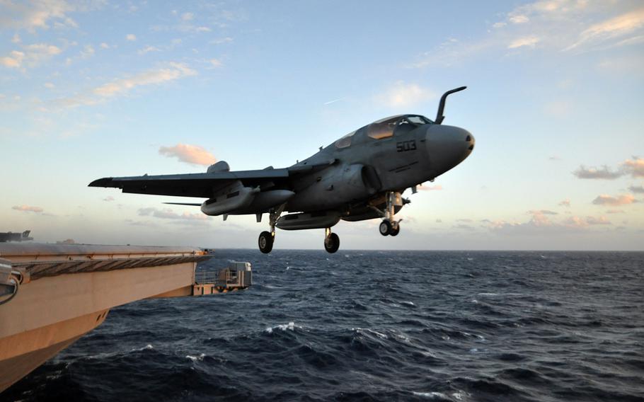 An EA-6B Prowler from the Patriots of Electronic Attack Squadron 140 launches from the Nimitz-class aircraft carrier USS Dwight D. Eisenhower December 5, 2012.