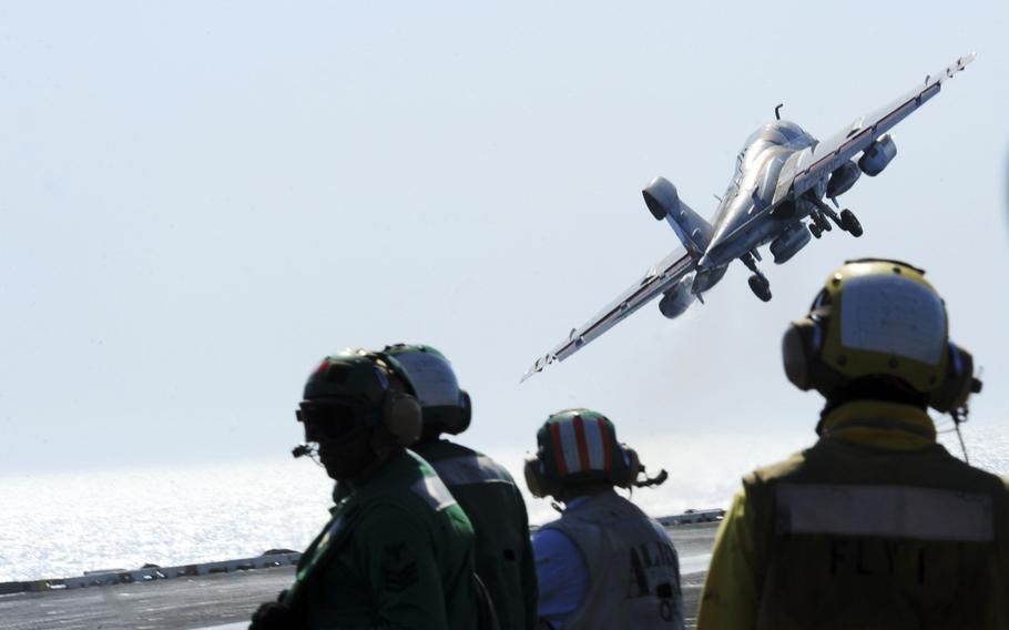 An EA-6B Prowler attached to the ''Garudas'' of Electronic Attack Squadron 134, takes off from the flight deck of the aircraft carrier USS George H.W. Bush on June 25, 2014.
