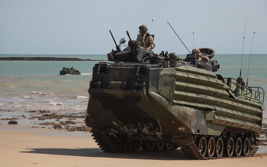 U.S. Marine Corps amphibious assault vehicles, assigned to the 31st Marine Expeditionary Unit, come ashore at Fog Bay, Australia, during exercise Talisman Sabre, July 8, 2015.