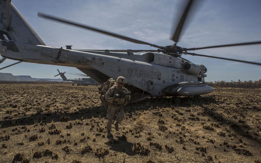 U.S. Marines with 1st Battalion, 4th Marine Regiment, exit a CH-53E Super Stallion Helicopter to prepare for a movement to contact exercise during the start of Exercise Talisman Sabre 15 on July 6, in Bradshaw, Northern Territory, Australia.