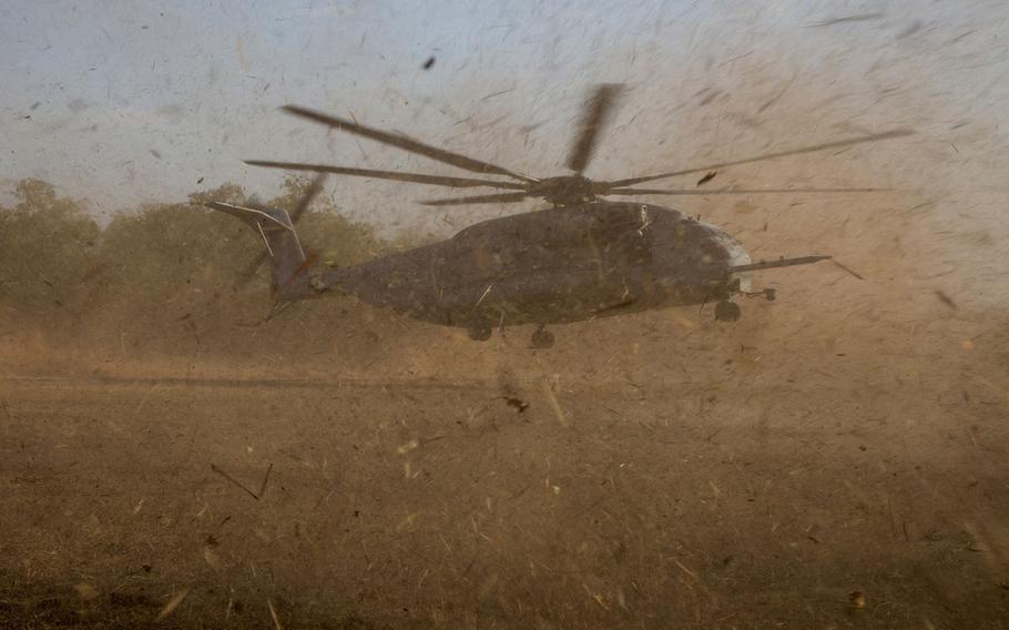 A U.S. Marine Corps CH-53E Super Stallion from Marine Medium Tiltrotor Squadron 265 (Reinforced), 31st Marine Expeditionary Unit, touches down at a landing zone while conducting a Tactical Recovery of Aircraft and Personnel during exercise Talisman Sabre 15 in Fog Bay, Northern Territory, Australia, July 9, 2015.
