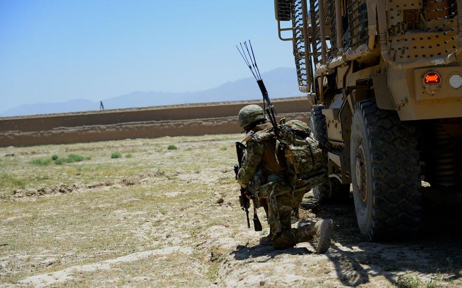 A Georgian soldier takes a defensive position during a June 10, 2015, joint force protection patrol with U.S. forces outside Bagram Air Field in Parwan province, central Afghanistan.