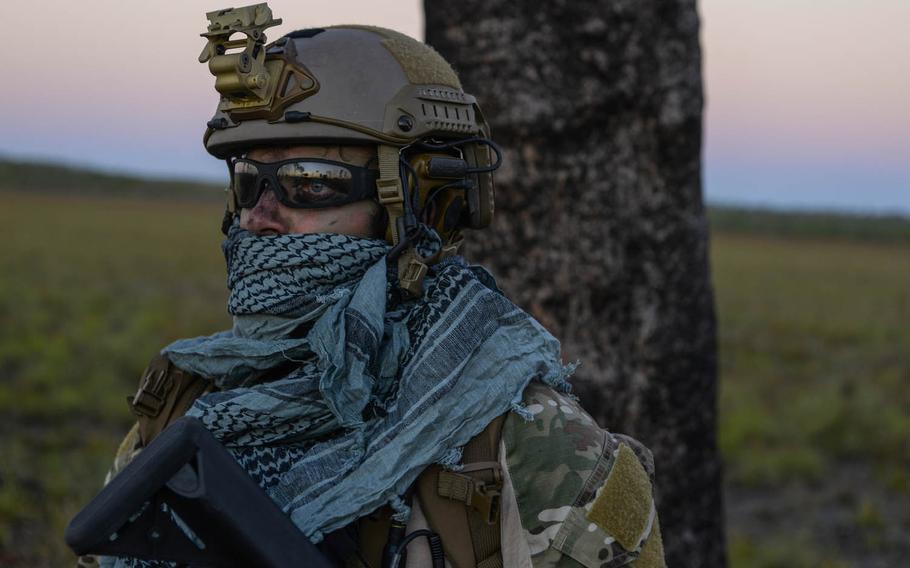 A special tactics combat controller from the 320th Special Tactics Squadron waits for the rest of his team to arrive after performing a high-altitude low opening jump during exercise Talisman Sabre in Northern Territory, Australia, on July 10, 2015. Talisman Sabre participants have the opportunity to further enhance their ability to respond to crises as part of a joint or combined effort.