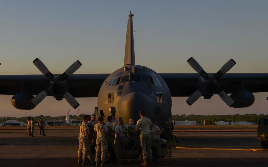Members of the 353rd Special Operations Maintenance Squadron hang out before preparing an MC-130H Combat Talon II for takeoff during Talisman Sabre exercises in the Northern Territory of Australia, July 13, 2015.