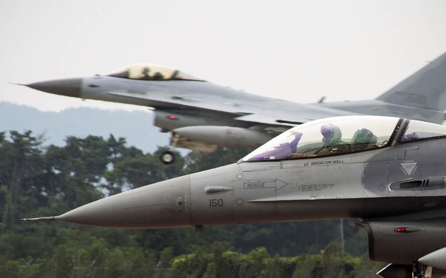 An F-16 Fighting Falcon from Kunsan Air Base prepares to take off as a South Korean KF-16 from Seosan Air Base, South Korea, lands in the background during an exercise on Aug. 20, 2014. The U.S. State Department has approved a possible $2.5 billion sale in F-16 upgrades to South Korea as part of Seoul's effort to revamp its aging fighter jet fleet. Congress has 30 days to block the sale.