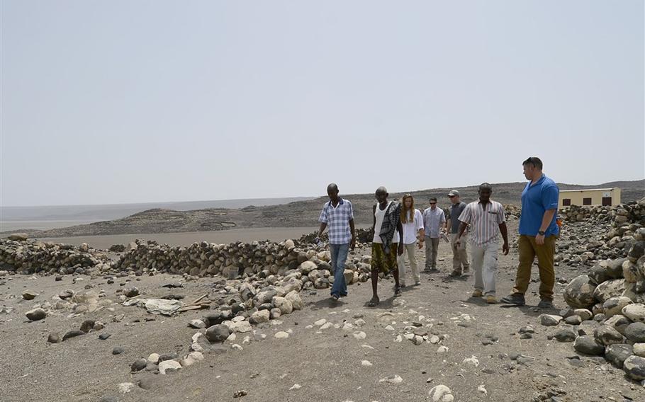 Members of the U.S. Army 404th Civil Affairs Battalion walk with village elders around Lake Abbe, Djibouti, on May 20, 2015. Recurrent drought in the region has made life difficult for the herdsman. A study released this week calls for countries to consider worst-case scenarios when examining the effects of climate change, to include failures of entire nations, terrorism, and resource competition.