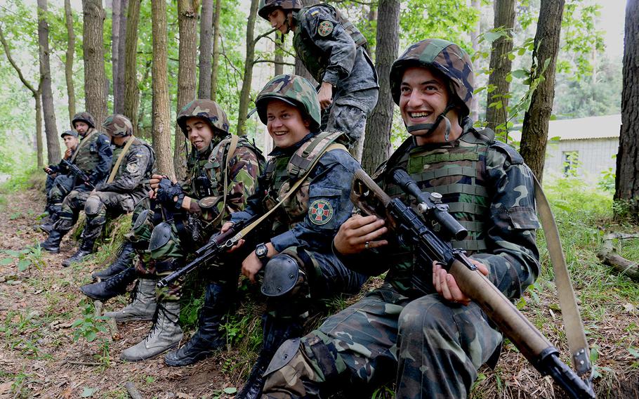 Ukrainian national guardsmen take a short rest during training with U.S. forces July 9, 2015, at a training base in Yavoriv, Ukraine.