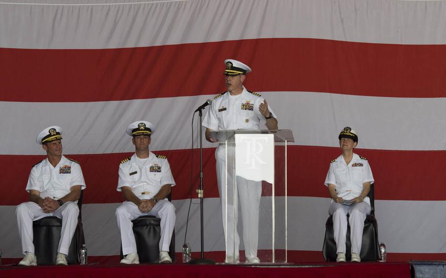 Capt. Daniel C. Grieco, outgoing commanding officer for USS Theodore Roosevelt, makes remarks during a change of command ceremony Tuesday,  July 21, 2015, in Bahrain. The ship is in Bahrain during a short break from an eight-month deployment in the Middle East.