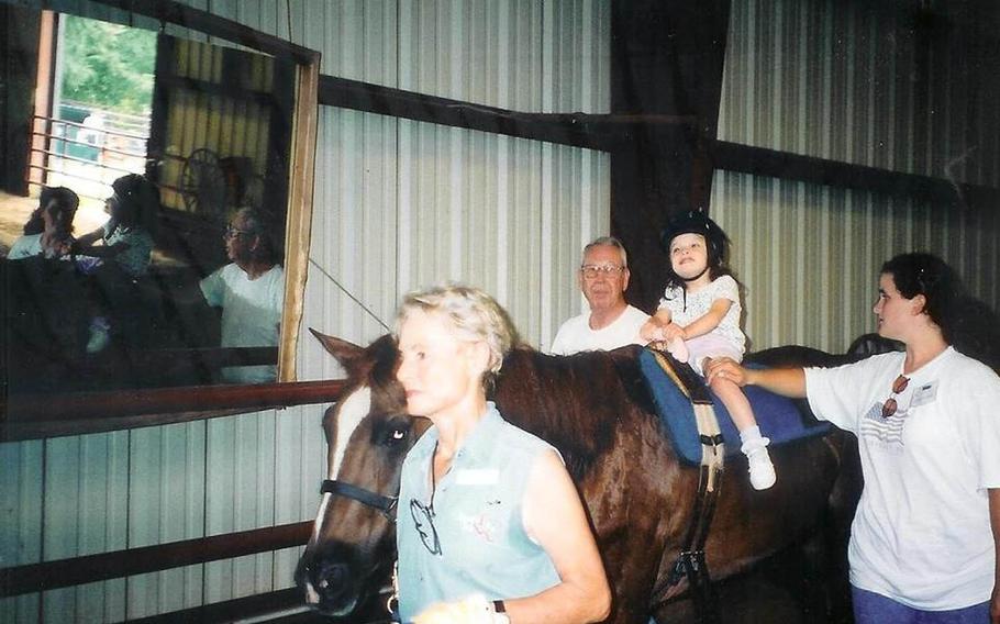 The Defense Department has agreed to a cash settlement with a retired Navy captain and his wife after the Defense Health Agency denied their daughter's Tricare claims for physical therapy using a horse, the family said July 23, 2015. Tricare notified the Samuels family in June 2010 that their daughter Kaitlyn's use of a horse during her physical therapy sessions was not covered because it constituted unproven treatment.