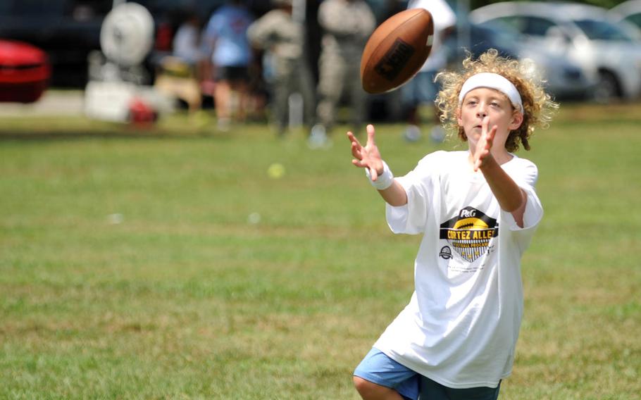 A future wide receiver lines up to snag a pass during a National Football League ProCamp, on Thursday, July 16, 2015, at Seymour Johnson Air Force Base, N.C. ProCamps are held all over the U.S., and internationally, to give children a chance to train with professional athletes.