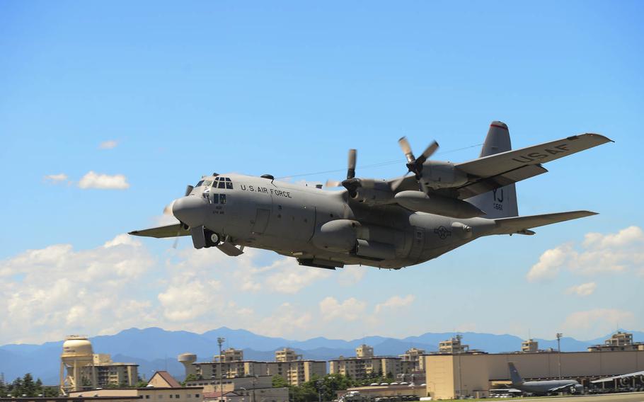 A C-130 Hercules takes off during a training exercise at Yokota Air Base, Japan, on Tuesday, July 14, 2015. Ten C-130s participated in the exercise which tested the 36th Airlift Squadron?s ability to perform large formation flights.