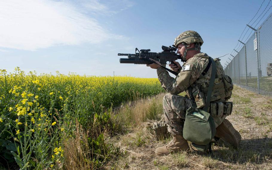 A 91st Security Forces Group member guards the fence line of a launch facility during an exercise near Donnybrook, N.D., on Monday, June 29, 2015. Airmen from 219th Security Forces Squadron and 791st Missile Security Forces Squadron worked together to pacify personnel dressed as simulated aggressors and recapture a launch facility.