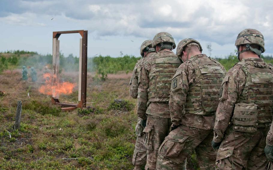 Soldiers with 503rd Infantry Regiment, 173rd Airborne Brigade Combat Team, stack up near a simulated door during a demolition range July 19, 2015, at the Central Training Area, near Tapa, Estonia, during Operation Atlantic Resolve. Throughout the day, soldiers practiced building and setting the various charges they had learned about the previous day.