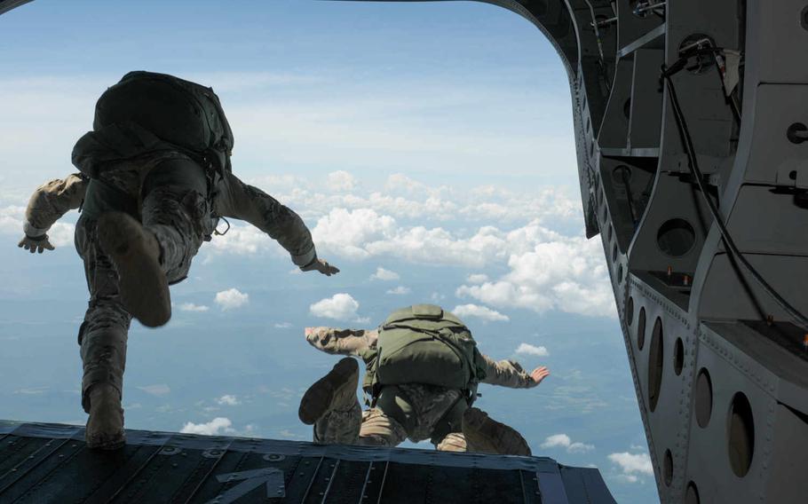 Maryland Army National Guard Soldiers freefall from 13,000 feet during a jump with C Company, 1st Squadron, 158th Cavalry Regiment, on July 18, 2015, over Little Orleans, Md. The LRS unit, based out of Hagerstown, is scheduled to be disbanded in August.