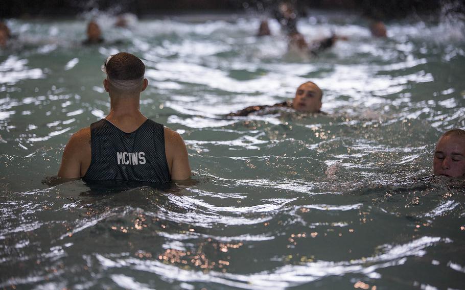 Recruits of Company B, 1st Recruit Training Battalion, swim 25 meters during basic water survival training July 20, 2015, on Parris Island, S.C.