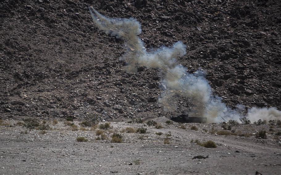 An Amphibious Assault Vehicle attached to 1st Battalion, 3rd Marine Regiment, launches an M58 Mine Clearing Line Charge during a live-fire training exercise aboard Marine Corps Air Ground Combat Center Twentynine Palms, Calif., July 21, 2015.
