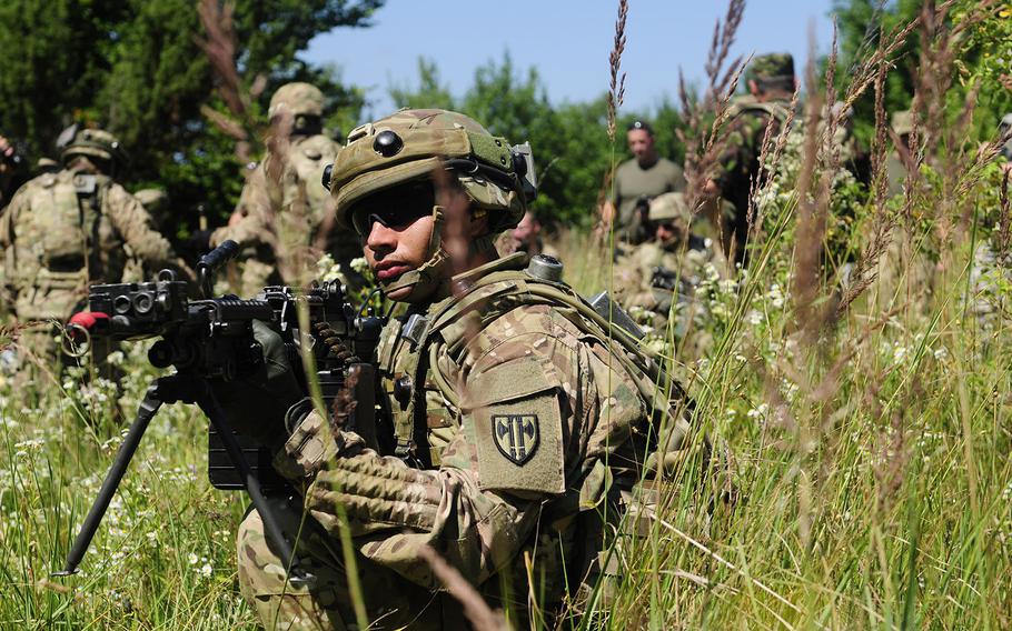 U.S. soldiers with 3rd Platoon, 615th Military Police Company, 709th Military Police Battalion, pull security at the multinational Exercise Rapid Trident 2015 at the International Peacekeeping and Security Center near Yavoriv, Ukraine, July 21, 2015. Nine Marines on their way to participate in a companion exercise, Saber Guardian, were held up in Vienna a couple of days earlier because they did not have clearances for their weapons.