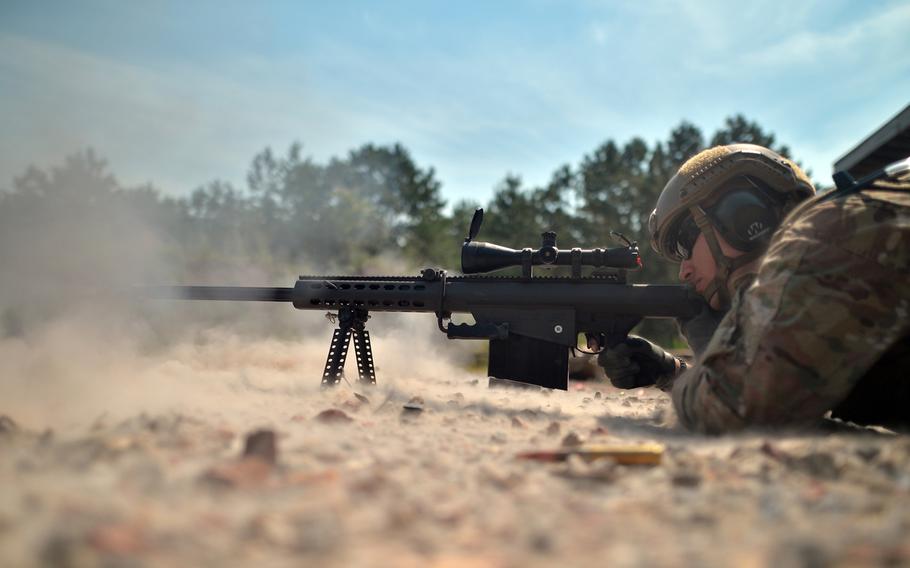 Staff Sgt. Carlos Butriago trains with a Barrett sniper rifle at the Suffolk County firing range in Westhampton Beach, N.Y., on Monday, July 27, 2015. Butriago is a member of the 106th Security Forces Squadron.