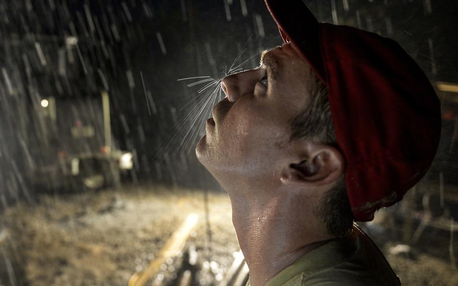 Staff Sgt. Fred Frizzell, an 823rd Expeditionary RED HORSE Squadron pavements and construction equipment operator, operates a drilling rig at a well site in Brisas del Mar, Honduras, on Thursday, July 30, 2015.