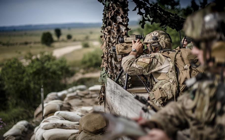 Senior Airman Paul Cauge, a 274th Air Support Operations Squadron joint terminal attack controller, uses a laser rangefinder designator for a close-air support training mission on Wednesday, July 29, 2015, at Grayling Air Gunnery Range in Grayling, Mich., during Northern Strike 2015.