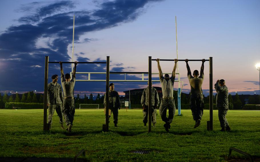 Airmen prepare for pull-ups during an Army pre-Ranger physical assessment, on Wednesday, Aug. 5, 2015 at Aviano Air Base, Italy. The assessment included a 5-mile run, push-ups, sit-ups and pull-ups.