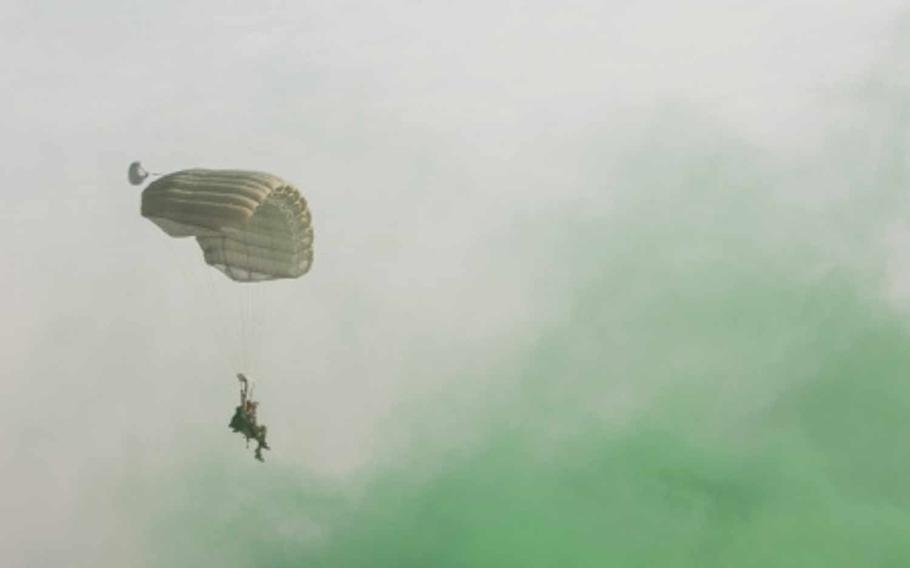 A U.S. Air Force pararescueman with a Guardian Angel team assigned to the 83rd Expeditionary Rescue Squadron parachutes to the ground during High Altitude Low Opening jump training at Bagram Air Field, Afghanistan, July 18, 2015. To mark the drop zone, green smoke was used to guide the pararescuemen to their landing point. An unnamed Guardian Angel unit is deploying to Diyarbakir Air Base, Turkey, to provide personnel recovery operations, if needed, for U.S. and coalition forces in Syria and Iraq.

Joseph Swafford/U.S. Air Force