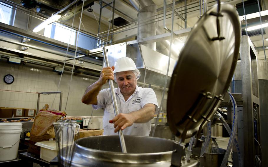 Yakup Cirt prepares Krispy Kreme doughnut icing at the Exchange Bakery Europe in Gruenstadt, Germany, on Monday, Nov. 9, 2015. AAFES bakers were given special training to produce the doughnuts, and are using original recipes.