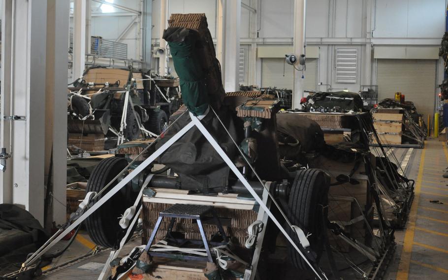 Soldiers at the heavy rigging facility at Aviano Air Base, Italy, on Saturday, April 9, 2016, prepare this howitzer to be dropped from a transport plane as part of exercise Saber Junction.